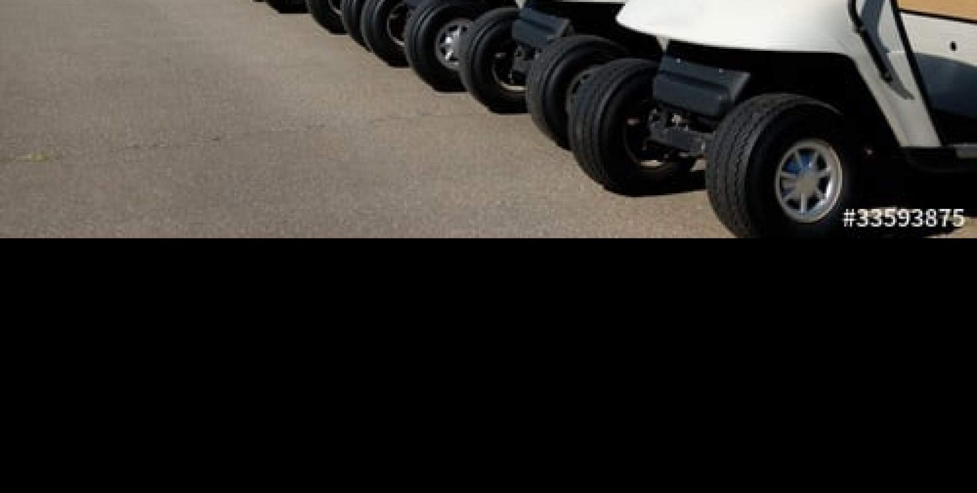 An image of golf buggies lined up at Overstone Park Resort, Northampton 
