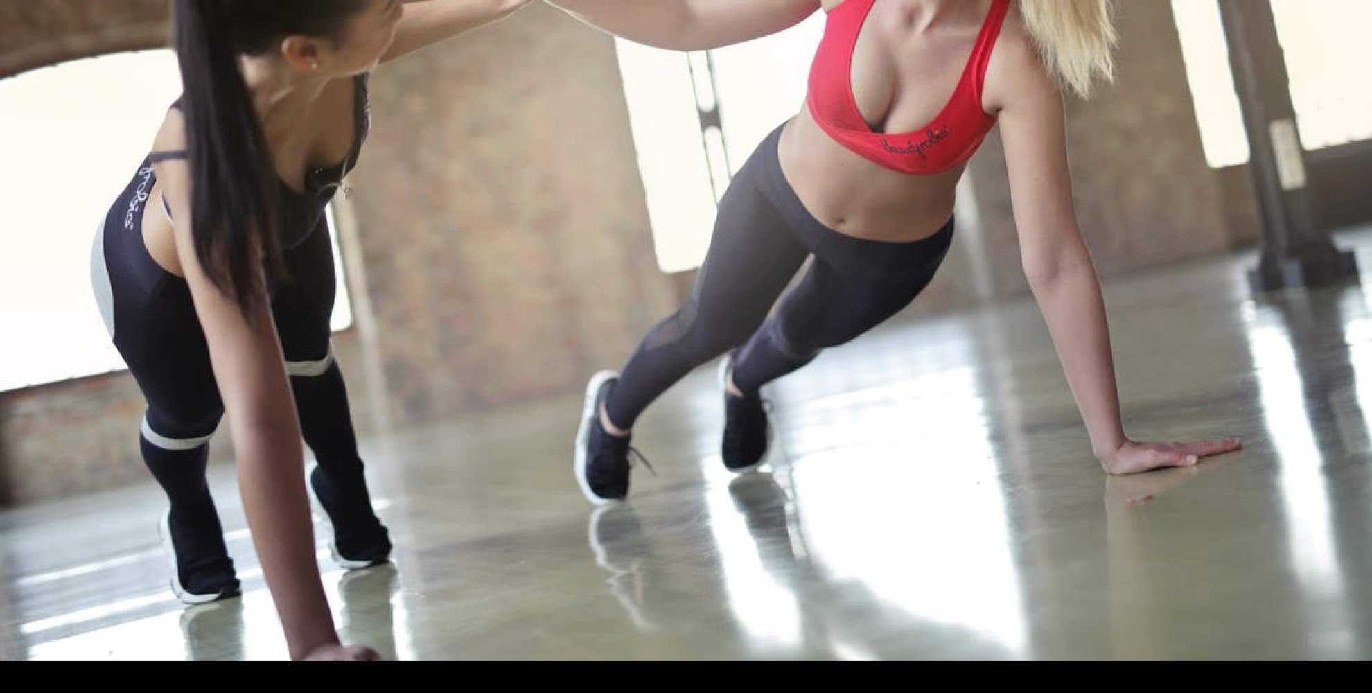 A picture of two women exercising at the Overstone Park Resort gym