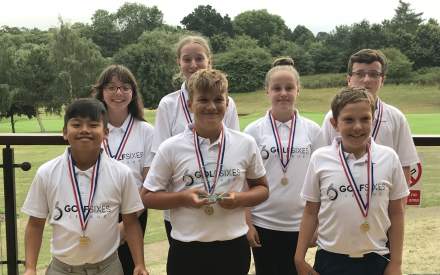 An image of several young golfers at the Overstone Park golf course, Northampton
